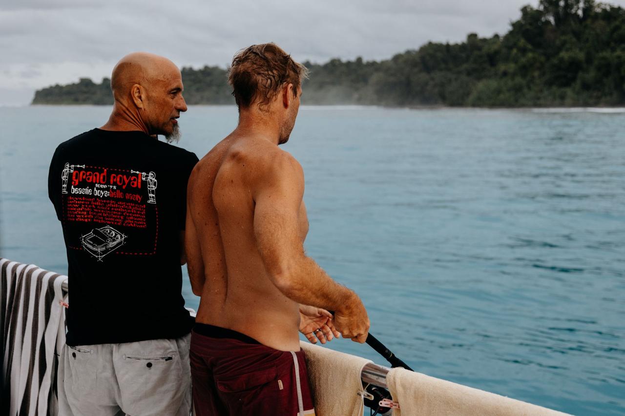 Xaver and a friend on the boat, looking out over the water