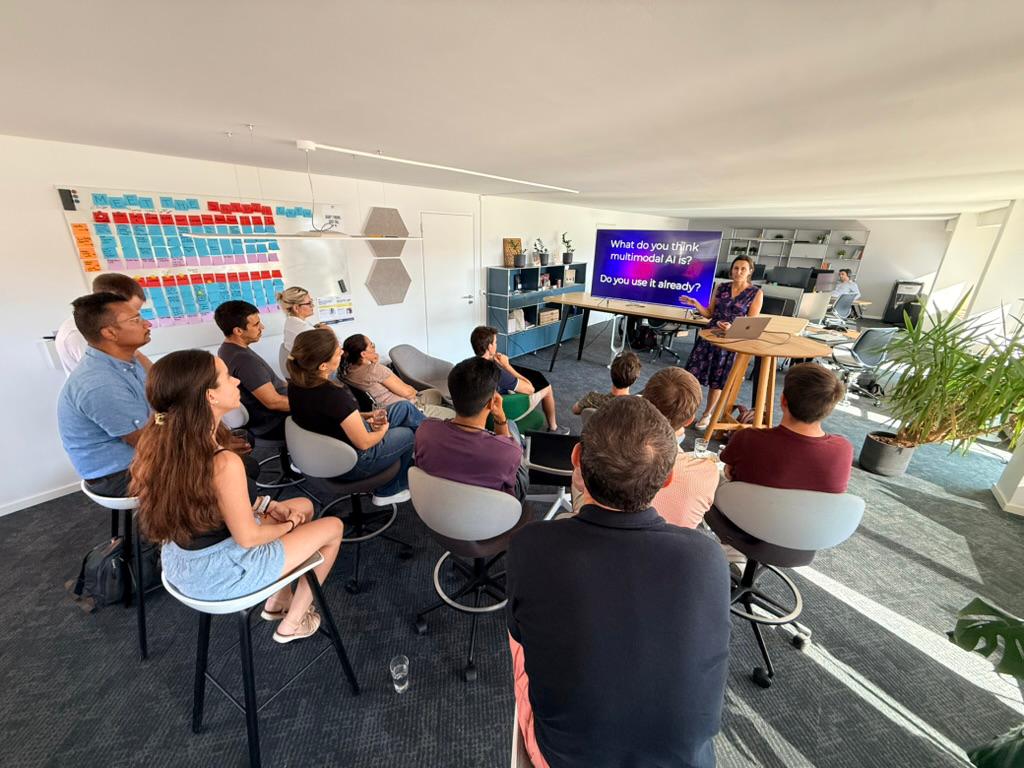 Teodora Vuković presenting to the Ship26 crew at Schifflände 26, a slide behind her asking the room what they think multimodal AI is